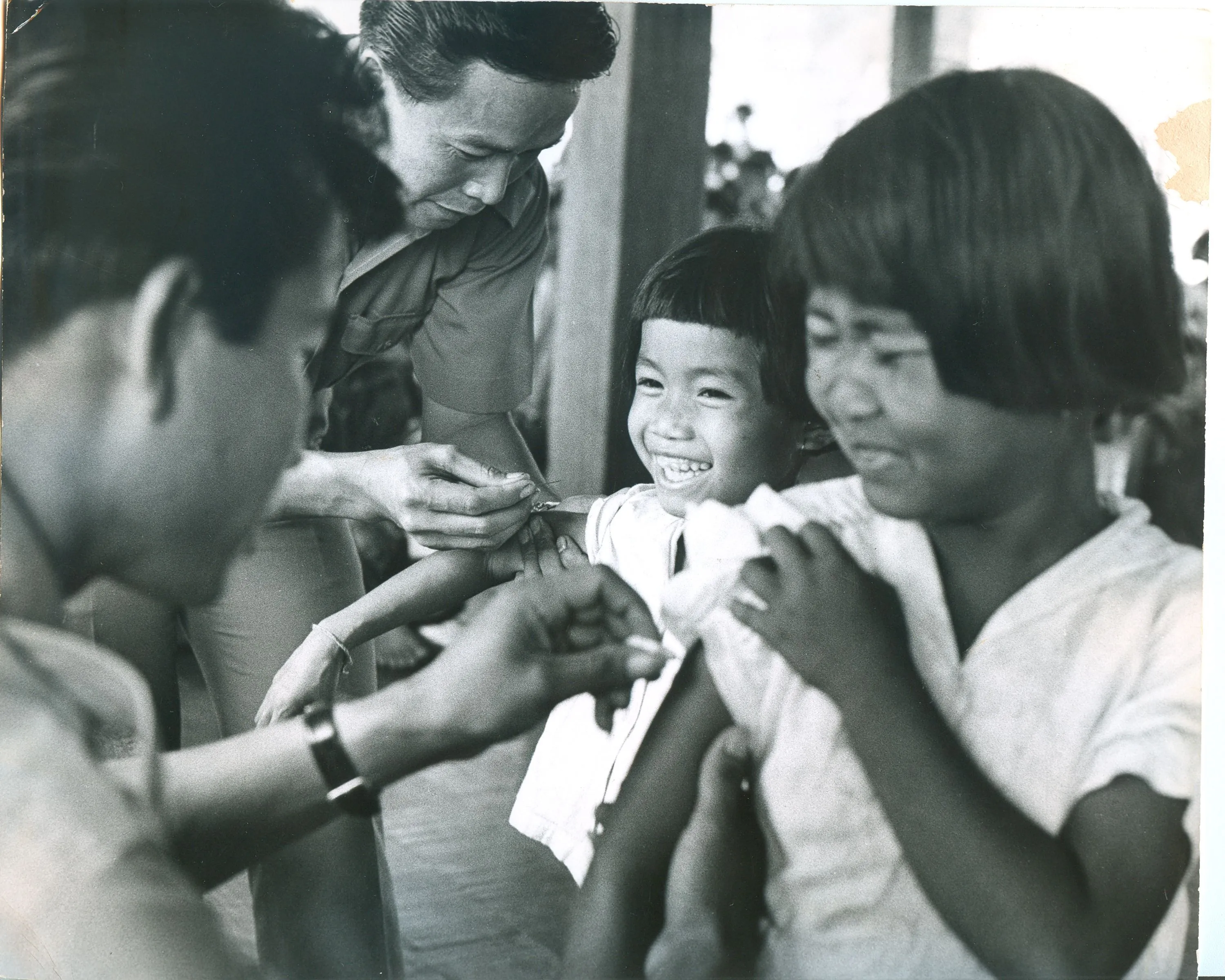 A child is vaccinated at a USAID-supported clinic